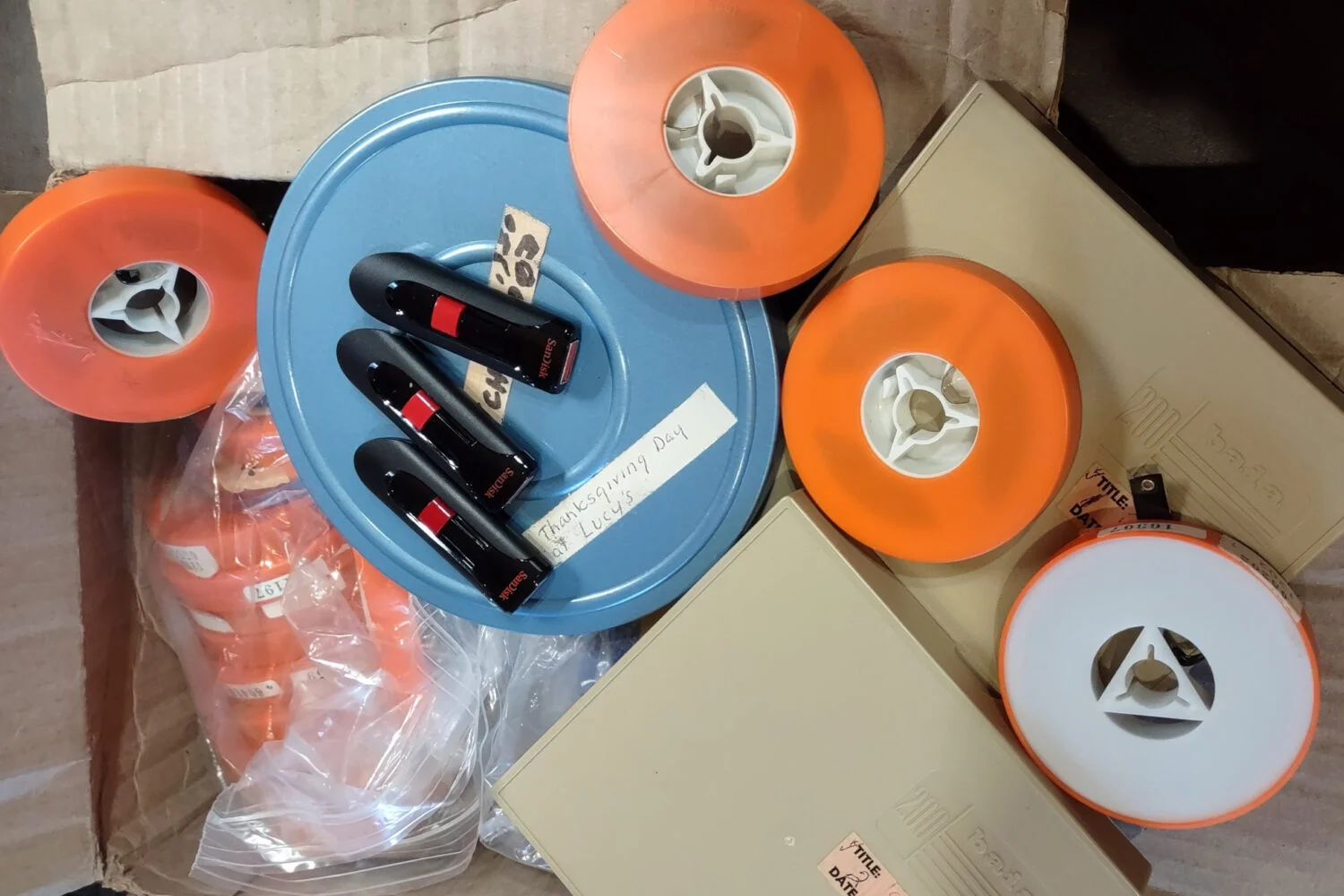 Film reels and USB drives ready to convert to MP4 files at blockbuster rates